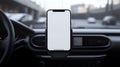 A plain white mock up smartphone screen in a phone holder on a car dashboard Royalty Free Stock Photo