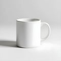 Plain white mockup cup placed against a plain white backdrop Royalty Free Stock Photo