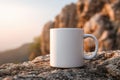 White Coffee Mug on Rocky Terrain at Sunrise Royalty Free Stock Photo