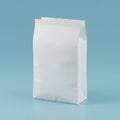 A plain white paper bag stands upright against a light blue background. The bag is Royalty Free Stock Photo