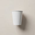 Plain white paper cup placed against Royalty Free Stock Photo
