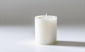 Plain white pillar candle on minimalist background, ideal for home decor essentials. Royalty Free Stock Photo