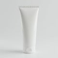 A plain white plastic squeezable tube with a flip-top cap, designed for packaging cream Royalty Free Stock Photo