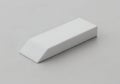 A plain white rectangular bar with tapered ends resting on a flat surface Royalty Free Stock Photo