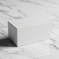 A plain white rectangular box placed on a white marble surface with Royalty Free Stock Photo
