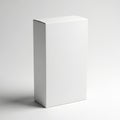 A plain white rectangular box standing upright on a light gray surface Royalty Free Stock Photo