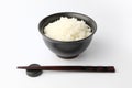 plain white rice in bowl with chopsticks isolated on white background Royalty Free Stock Photo