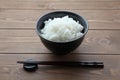 plain white rice in bowl with chopsticks isolated on table Royalty Free Stock Photo