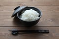 plain white rice in bowl with chopsticks isolated on table Royalty Free Stock Photo