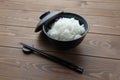 plain white rice in bowl with chopsticks isolated on table Royalty Free Stock Photo
