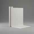 A plain white roll of paper partially unfurls, standing upright against a gray Royalty Free Stock Photo