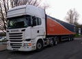 Plain white Scania R450 highline with a specialist steel carrier trailer