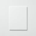 A plain, white sheet of paper is centered on a smooth, white background. The paper\'s Royalty Free Stock Photo