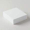 Plain, white square box with a smooth surface on a neutral background. The box is Royalty Free Stock Photo