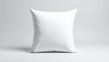 A plain white square cushion with a soft fabric texture on a light gray background pillow Royalty Free Stock Photo