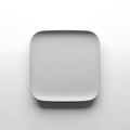 A plain white square paper plate set against a neutral background Royalty Free Stock Photo