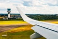 Plain wing over Belgium. Flight from Amsterdam to Brussels