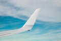 Plain wing over blue sky. Flight from Helsinki to Amsterdam Royalty Free Stock Photo