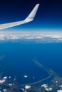 Plain wing over blue sky. Flight from Helsinki to Amsterdam Royalty Free Stock Photo