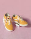 Plain yellow converse sneakers isolated on a bright background