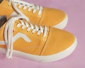 Plain yellow converse sneakers isolated on a bright background