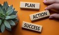 Plan Action Success symbol. Concept word Plan Action Success on wooden blocks. Businessman hand. Beautiful orange background. Royalty Free Stock Photo