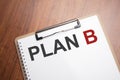 PLAN B text on white paper on the wood table Royalty Free Stock Photo