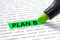Plan b word highlighted with marker on paper of other word