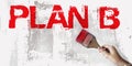 Plan B words in red and brush in hand on grundge white grey background. Crisis management business concept