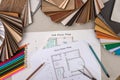 Plan house with wooden models, pencils, pen Royalty Free Stock Photo