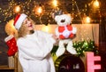 Plan for some interesting activity. Moms christmas routine. Woman teddy bear toy and gift christmas decorations