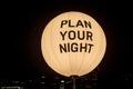 Plan your night written on a sphere at night. City night life concept. Planning ahead safety Royalty Free Stock Photo