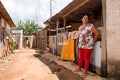 Planaltina, Goias, Brazil-August 23, 2019: A poor woman stands in front of her home Royalty Free Stock Photo