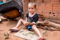 Planaltina, GoiÃÂ¡s, Brazil-August 4, 2018: A little boy playing with a knife