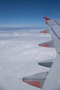 Plane wings and clouds, view from the window of the plane Royalty Free Stock Photo