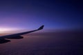 Plane, aeroplane wing, clouds, gradient sky from aerial view