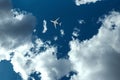 The plane against the blue sky and fluffy clouds. Concept of vacation, vacation, flight, travel