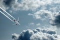 The plane against the blue sky and fluffy clouds. Concept of vacation, vacation, flight, travel