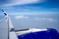 A plane in the air, taken from inside the airplane. Cloud view from plane. Creative plane shot