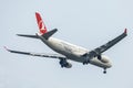 Plane or aircraft of Turkish Airlines or Airways on the sky landing to Suvanabhumi airport. Royalty Free Stock Photo