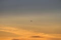 The plane travels among the colorful clouds of the sunset Royalty Free Stock Photo