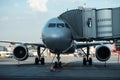 Plane on airport connected to gate sleeve