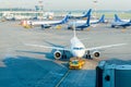 Plane on airport connected to gate sleeve. Aircraft and sleeve. Gate at the airport for passengers to plane