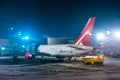 The plane at the airport disembarks passengers through the sleeve