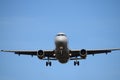 Commercial airplane in flight approaching airport runway. Royalty Free Stock Photo