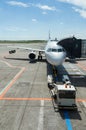 Plane awaiting on passengers Royalty Free Stock Photo