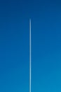 plane in blue sky, straight line. quality photo Royalty Free Stock Photo