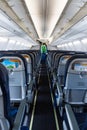 Plane boarding, young adult woman leaving an airplane