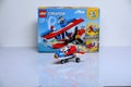 Plane built from Lego bricks and its box