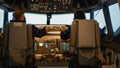 Plane captain and woman copilot fixing altitude on dashboard